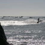 Surfers enjoying the waves on Moonstone Beach in Cambria